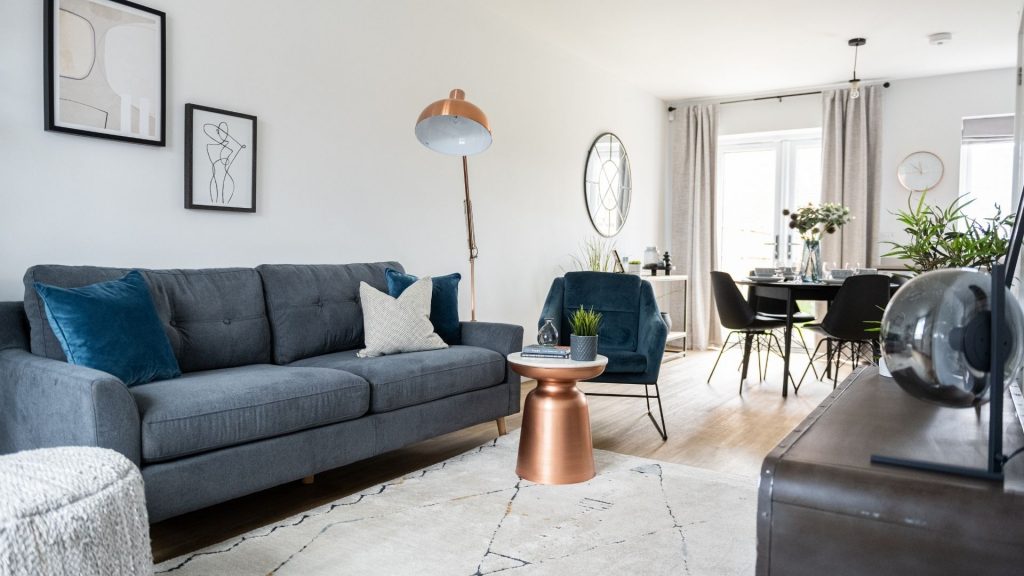A wide shot of an open plan living/dining room space designed by Natalie Holden Interiors.